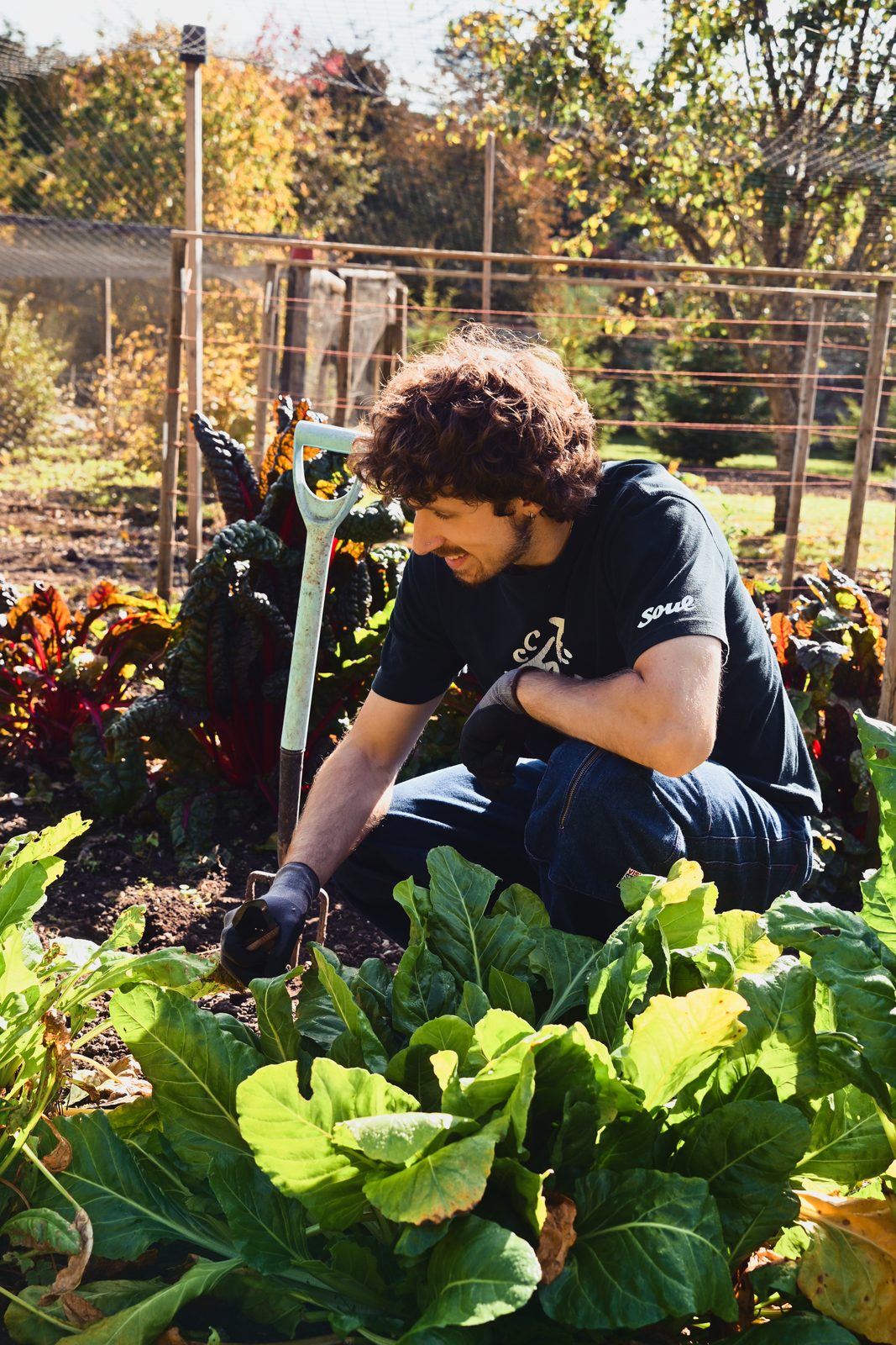 Sol Paradise playing trumpet in a garden